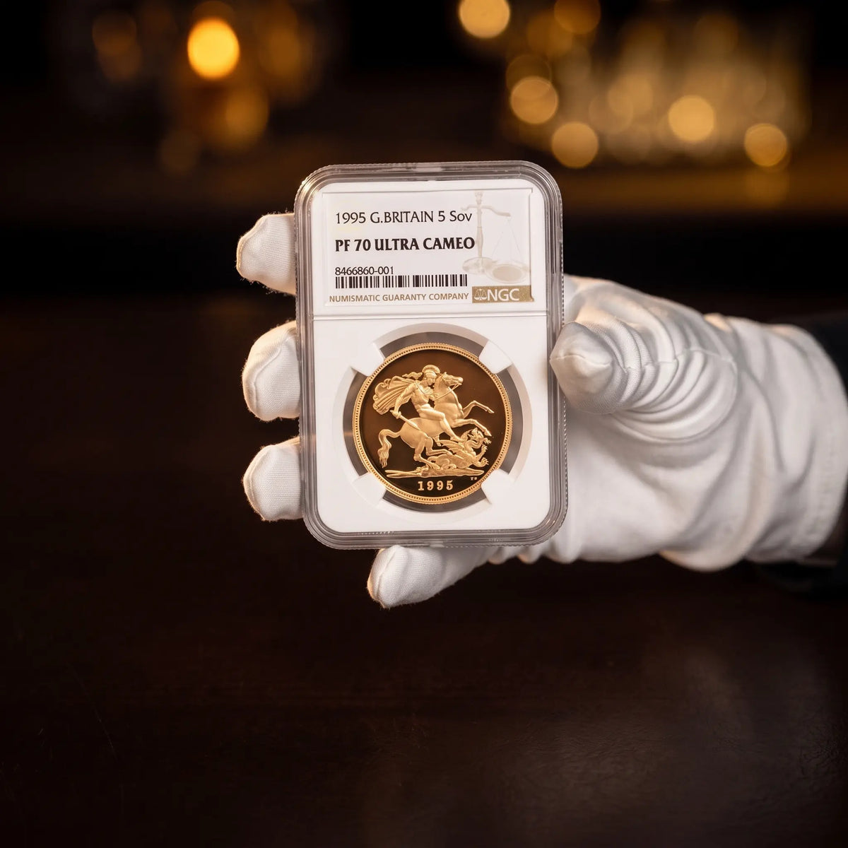 NGC PF70 graded gold Five Sovereign coin sealed in a certified slab, from Gold Tier Advisory